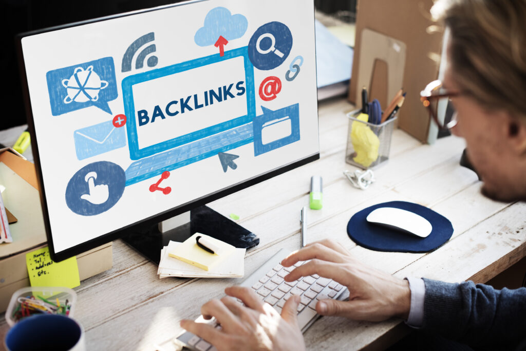 Desktop setup with monitor and keyboard displaying backlinks
