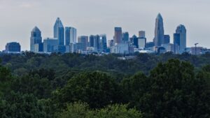 Charlotte, NC skyline with modern skyscrapers and greenery