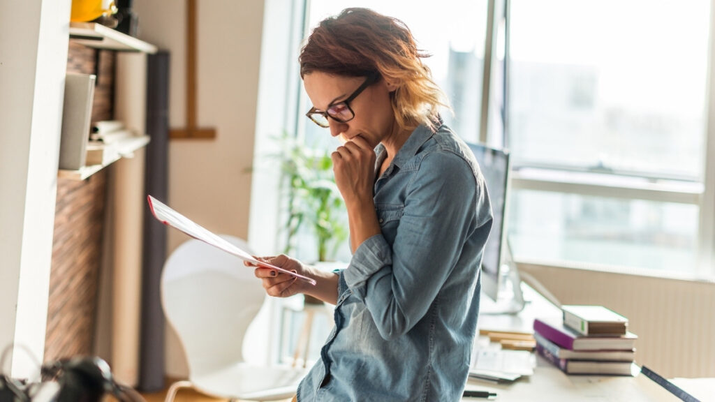 looking intently at a document